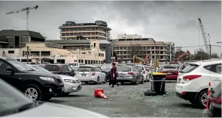  ?? PHOTO: IAIN McGREGOR/FAIRFAX NZ ?? Cars parked around the hospital yesterday on the site earmarked for the proposed metro sports hub.