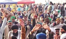  ?? ANI ?? Farmers shout slogans during the ongoing protest against the new farm laws at Ghazipur Border, in New Delhi yesterday.