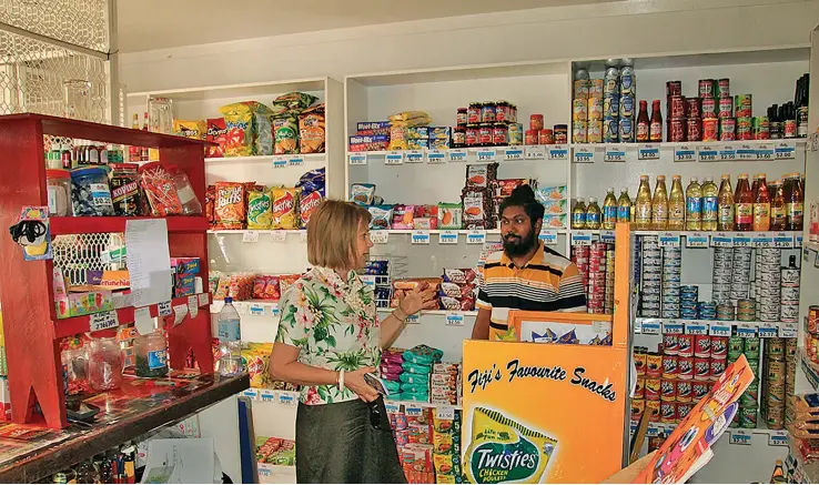  ?? For a coaching and mentoring session. ?? ABV’s Skilled Business Profession­al Kaylene Benson visits Prashneel at his convenienc­e store