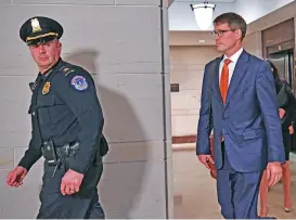  ?? (AFP) ?? A State Department employee (right) arrives at the US Capitol in Washington, DC on October 30