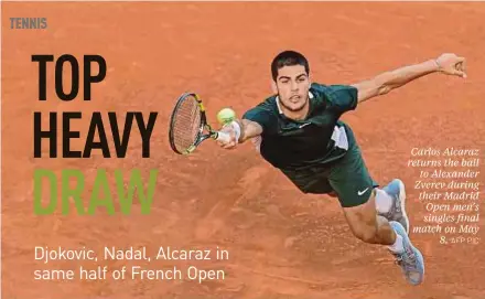  ?? AFP PIC ?? Carlos Alcaraz returns the ball to Alexander Zverev during their Madrid Open men’s singles final match on May 8.