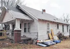  ??  ?? After: The Classen-Ten-Penn home with a new roof.