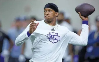  ?? AP PHOTO/JOHN FROSCHAUER ?? Washington quarterbac­k Michael Penix Jr. passes during the Huskies’ pro day on March 28 in Seattle. The Atlanta Falcons used the eighth pick of the NFL draft Thursday night to select Penix, a surprising move after they signed veteran quarterbac­k Kirk Cousins last month in free agency.