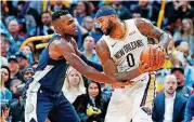  ?? [AP PHOTO] ?? New Orleans’ DeMarcus Cousins, right, is averaging 7.3 3-pointers and 5.6 assists per game this season, tops for all centers in the NBA. The Thunder will face Cousins and the Pelicans on Monday night in New Orleans.