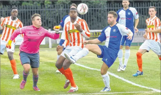  ?? Picture: Brian Green FM4491036 ?? Herne Bay challenge the Ashford Town keeper as the visitors from Middlesex are put under pressure in the FA Cup Winch’s Field on Saturday