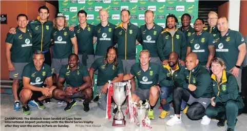  ?? PICTURE: HENK KRUGER ?? CHAMPIONS: The Blitzbok team landed at Cape Town Internatio­nal Airport yesterday with the World Series trophy after they won the series in Paris on Sunday.