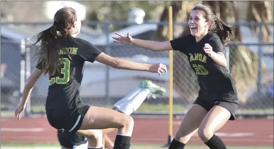  ?? Dan Watson/ The Signal ?? Canyon teammates Bailey Williamson (23) and Taylor Arietta (20) celebrate after the latter’s game-tying goal in the second half of Friday’s CIF Southern Section second-round matchup against the Montclair Cavaliers at Canyon High School.