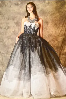  ??  ?? Black and white tulle ball gown with black jet beading and black painting.