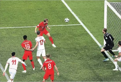  ?? RYAN PIERSE GETTY IMAGES ?? England’s Harry Kane scores the winning goal Monday against Tunisia at soccer’s World Cup.