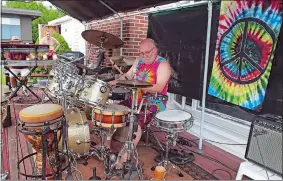  ?? PHOTOS COURTESY OF LORAIN OHIO SIMISTER ?? Above, Arthur “Art” Falconi on drums during one of the annual birthday bashes he hosted at his New London home. Left, Falconi with his longtime partner, Kathy Vega.