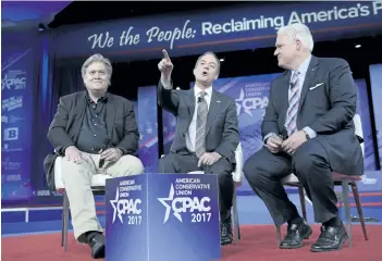  ?? SUSAN WALSH/THE CANADIAN PRESS ?? White House Chief of Staff Reince Priebus, centre, is seen with White House strategist Stephen Bannon, left, and American Conservati­ve Chairman Matt Schlapp, during the Conservati­ve Political Action Conference in Oxon Hill, Md.