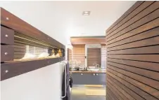  ??  ?? Bathroom in Resene Colorwood Mahogany with Resene Black White and Resene All Black. Project by Fraser Gillies. Photo / Frances Oliver.