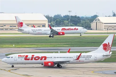  ??  ?? Boeing 737-900ERs of Thai Lion Air and Malindo, both LCCs under Indonesia’s Lion Group, taxiing at Bangkok’s Don Mueang airport, billed as the busiest LCC hub in Southeast Asia. LCCs are gaining bigger share in Thailand’s airline traffic.