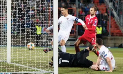  ??  ?? Cristiano Ronaldo’s late goal wrapped up victory for Portugal in Luxembourg. Photograph: TF-Images/Getty