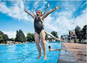  ?? ?? Swimmers soak up the sun yesterday in Cheltenham