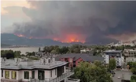  ?? Bonita Kay Summers/Reuters ?? Smoke rises during a wildfire in Kelowna, British Columbia, on Thursday. Photograph: