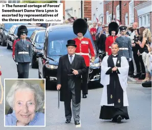  ?? Gareth Fuller ?? > The funeral cortege of Forces’ Sweetheart Dame Vera Lynn is escorted by representa­tives of the three armed forces