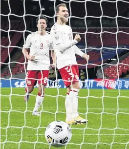  ?? PHOTO: REUTERS ?? Nothing but net . . . Denmark midfielder Christian Eriksen celebrates after scoring from the penalty spot in his side’s 10 Nations Cup win over England yesterday. Teammate Thomas Delaney looks on.