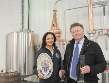  ??  ?? Faye Healy, with Tony Healy holding two tubes of Gin in Dundalk Bay Brewery, Finnabair Business Park. Photo: Aidan Dullaghan/Newspics.