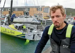  ?? JOHN HAWKINS/STUFF ?? French solo racing yacht skipper Thomas Ruyant with his yacht, Le Souffle De Nord, in Bluff Harbour in 2016 after the yacht was damaged near the bow at sea during the Vendee Globe race.