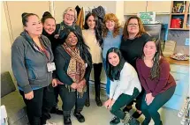  ?? AP ?? Prince William and Kate, Duchess of Cambridge visit MyLahore’s flagship restaurant in Bradford, England, while in Canada, Meghan, Duchess of Sussex, centre, poses with staff members of the Downtown Eastside Women’s Centre during a visit to the shelter in Vancouver, British Columbia.