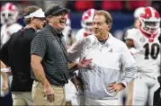  ?? ASSOCIATED PRESS ?? Georgia head coach Kirby Smart chats with Alabama counterpar­t Nick Saban before the kickoff of the SEC Championsh­ip game Dec. 4 in Atlanta. Georgia lost but gets another chance Monday night.