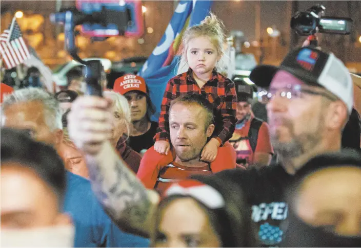  ?? Courtney Pedroza / Getty Images via AFP ?? Trump supporters gather to protest the election results in Phoenix, Arizona.