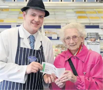  ??  ?? Prizewinne­r This week’s winner of the Butcher Boy competitio­n is Grace Reid from Livingston. She is pictured receiving her prize from Shaun Frampton of Boghall Butchers.