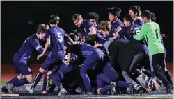  ??  ?? Sagahon is mobbed by his teammates after he made the game-clinching save in Branham’s CIF-CCS Division II championsh­ip victory.