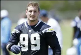  ?? GREGORY BULL — THE ASSOCIATED PRESS FILE ?? The Chargers’ statement Wednesday said they believe No. 1 pick Joey Bosa “... will be unable to contribute for the full 16-game season without the adequate time on the practice field, in the classroom, and in preseason games.”