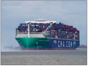  ?? (AP/dpa/Marcus Brandt) ?? A container ship operated by France’s CMA CGM shipping company moves Monday along the Elbe river toward the port in Hamburg, Germany.