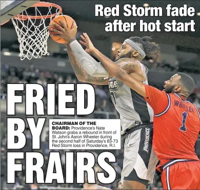  ?? ?? CHAIRMAN OF THE BOARD: Providence’s Nate Watson grabs a rebound in front of St. John’s Aaron Wheeler during the second half of Saturday’s 83-73 Red Storm loss in Providence, R.I.