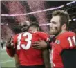  ?? CURTIS COMPTON — ATLANTA JOURNALCON­STITUTION ?? Georgia’s Jake Fromm and Jonathan Ledbetter react after their overtime loss to Alabama in the College Football Playoff National Championsh­ip last season in Atlanta.