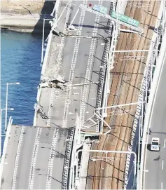  ?? — Reuters photo ?? A bridge connecting Kansai airport, damaged by crashing with a 2,591-tonne tanker, is seen in Izumisano in this photo taken by Kyodo.