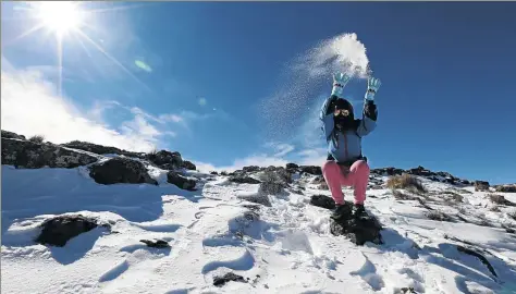  ?? / JACKIE CLAUSEN ?? Mapaseka Makoae is having fun in the snow that fell over the Drakensbur­g and Lesotho this week. The cold front has made its presence felt in Gauteng since Monday, but warmer weather is expected from today.