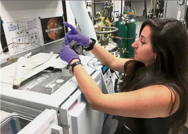  ?? — AFP ?? Detailed work: Millan working in a lab at Nasa’s Goddard Space Flight Center in Greenbelt, Maryland. She works on identifyin­g the chemical compositio­n of samples analysed on Mars by the SAM instrument onboard the Curiosity rover.