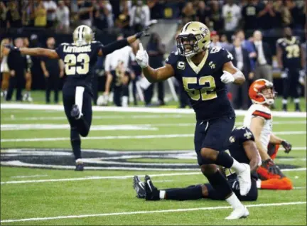  ?? BUTCH DILL — ASSOCIATED PRESS ?? Saints linebacker Craig Robertson (52) celebrates after Browns kicker Zane Gonzalez, right, missed a field goal during the second half Sept. 16 in New Orleans.