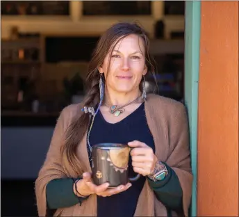  ?? NATHAN BURTON/Taos News ?? Owner Lacy Archer stands for a portrait outside of Mountain Monk Coffee on Monday (April 3) in Ranchos de Taos.