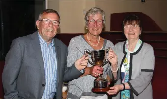  ??  ?? The Marion Coyne Perpetual Cup 2017 winner Olivia Kenny, with Mary and Jim Coyne at the presentati­on. Mary Coyne presenting Olivia Kenny, the winner of the Marion Coyne Perpetual Cup 2017.