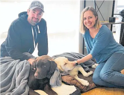  ??  ?? Gus and Fenn rest up at home with owners Adam and Sam Joyce after their two-day ordeal.