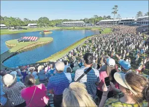 ?? 8*-- %*$,&: '-03*%" 5*.&4ű6/*0/ ?? A packed crowd stands for the national anthem on the 17th hole at the start of military appreciati­on day ceremonies Tuesday at the Stadium Course at TPC Sawgrass during The Players Championsh­ip week in Ponte Vedra Beach, Fla.