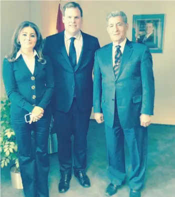  ?? Mincanada.com ?? The office of Foreign Affairs Minister John Baird, centre, says the minister was tricked into meeting with Syrian honorary consul Nelly Kanou, left, and writer Ahmad (Eed) Murad in March after Canada severed diplomatic ties with Syria.
