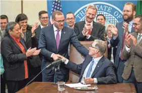  ?? STEPHEN BRASHEAR/AP IMAGES FOR HUMAN RIGHTS CAMPAIGN ?? The Human Rights Campaign’s Chad Griffin joined Washington Gov. Jay Inslee as he signed a bill banning conversion therapy for sexual orientatio­n or gender identity March 28.
