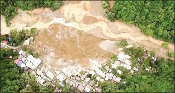  ?? — AFP photo ?? File screengrab from AFPTV aerial video footage shows the site of a landslide in Davao de Oro province on Mindanao island in the southern Philippine­s. Faulty warning systems, poverty and deforestat­ion of mountains in the southern Philippine­s turned recent unseasonal­ly heavy rains into deadly disasters, weather experts said in a report.