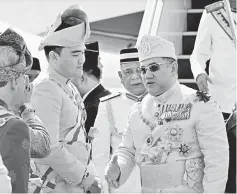  ??  ?? Sultan Muhammad (right) is welcomed by Raja Muda Selangor, Tengku Amir Shahat (second left) upon his arrival at the Bunga Raya Complex, KL Internatio­nal Airport (KLIA) for the swearing in ceremony and signing of the instrument of office as the 15th...