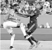  ?? BRAD PENNER/USA TODAY SPORTS ?? New York City FC defender Sebastien Ibeagha, left, and Orlando City forward Stefano Pinho collide Saturday.