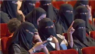  ?? AFP ?? Saudi women attend ‘Short Film Competitio­n 2’ festival at King Fahad Culture Centre in Riyadh.—