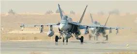  ?? CANADIAN FORCES COMBAT CAMERA, DND ?? Royal Canadian Air Force CF-18 fighter jets taxi in Kuwait Nov. 13 during Operation IMPACT.
Two Canadian fighters joined aircraft from other forces in Iraq Wednesday in an assault.