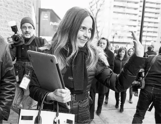  ?? John Mahoney / MONTREAL GAZETTE files ?? Pierre Karl Péladeau’s fiancée, Julie Snyder, waves to reporters outside Parti Québécois headquarte­rs in Montreal last year.