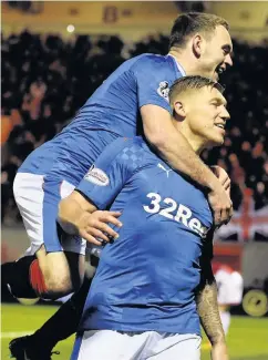  ??  ?? Two good Rangers striker Martyn Waghorn celebrates the second of his double against Hamilton